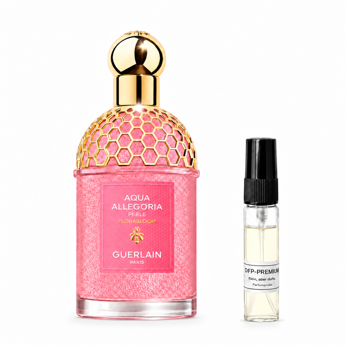 Pink Guerlain Aqua Allegoria Florabloom Perle bottle with a golden honeycomb pattern beside a DFP perfume sample on a white background.
