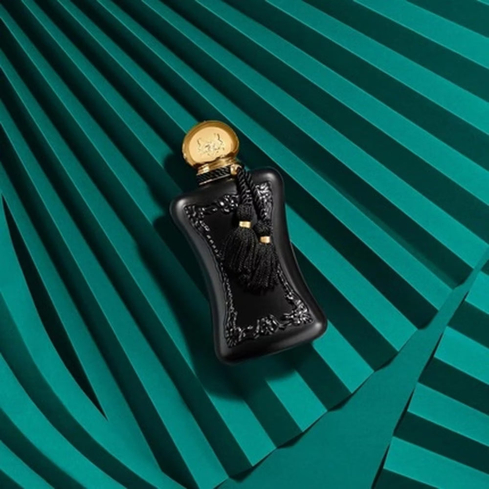 Black bottle of Parfums de Marly Athalia Eau de Parfum on a teal background with geometric folds.