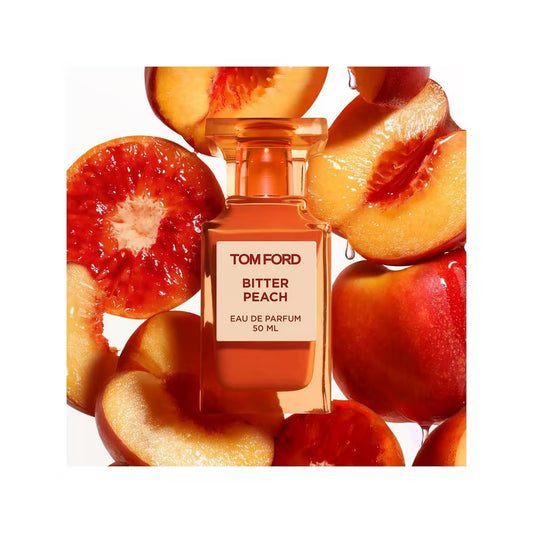 Tom Ford Bitter Peach Eau de Parfum in an orange bottle surrounded by cut peaches.
