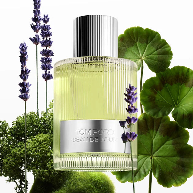 Tom Ford Beau de Jour Eau de Parfum among lavender flowers, green leaves and moss.