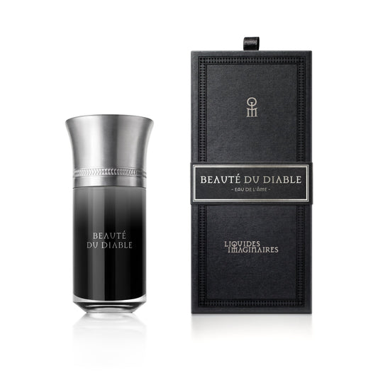 Liquides Imaginaires Beauté du Diable: flacone nero con tappo argentato accanto alla confezione originale aperta.