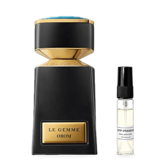 Bvlgari Le Gemme Orom: Originalflakon neben einer DFP Parfumprobe im Glaszerstäuber mit schwarzer Kappe auf weissem Hintergrund.