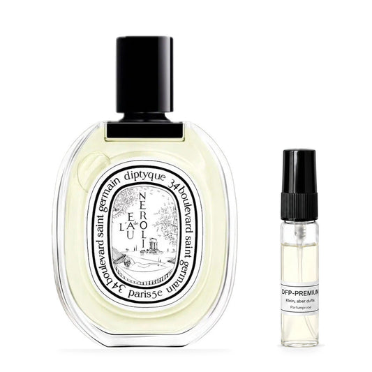Diptyque L'eau de Néroli: Originalflakon neben einer DFP Parfumprobe im Glaszerstäuber mit schwarzer Kappe auf weissem Hintergrund.