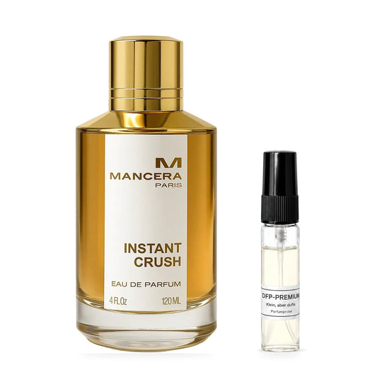 Mancera Instant Crush: Originalflakon neben einer DFP Parfumprobe im Glaszerstäuber mit schwarzer Kappe auf weissem Hintergrund.
