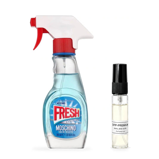 Moschino Fresh Couture: Originalflakon neben einer DFP Parfumprobe im Glaszerstäuber mit schwarzer Kappe auf weissem Hintergrund.