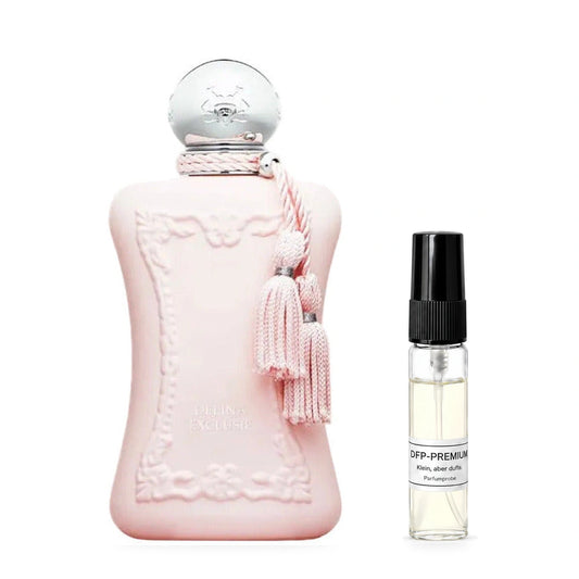 Parfums de Marly Delina Exclusif: Originalflakon neben einer DFP Parfumprobe im Glaszerstäuber mit schwarzer Kappe auf weissem Hintergrund.