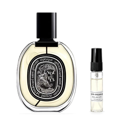 Diptyque Volutes: Originalflakon neben einer DFP Parfumprobe im Glaszerstäuber mit schwarzer Kappe auf weissem Hintergrund.