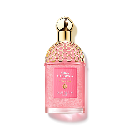 Guerlain Aqua Allegoria Florabloom Perle bottle with pink fragrance pearls, a golden honeycomb pattern and a spherical cap, isolated from the background.